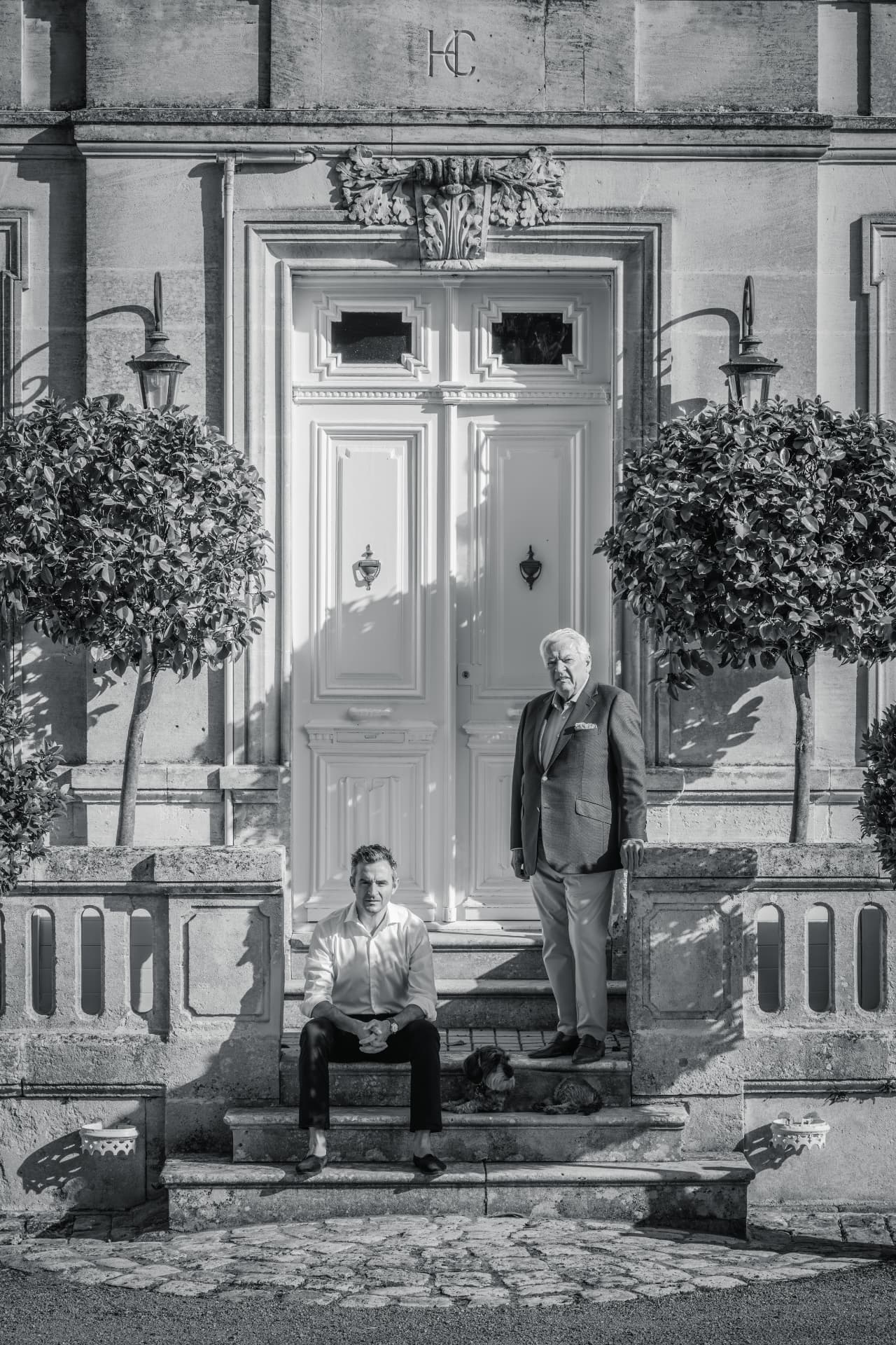 Thomas Menier and Jacques Menier at the door of the main house.